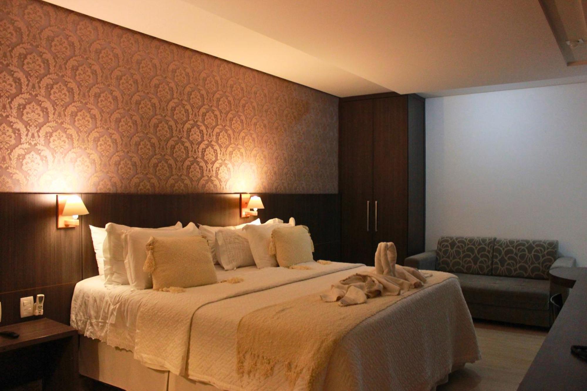 Gontijo Inn Hotel Itajubá Kültér fotó A bedroom in a hotel